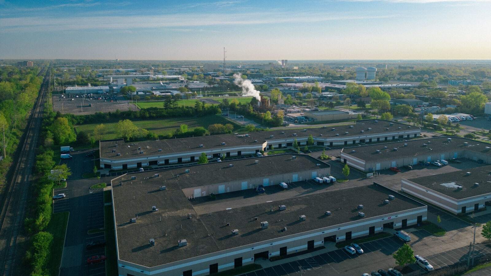 Aerial view of an industrial area with warehouses and roads